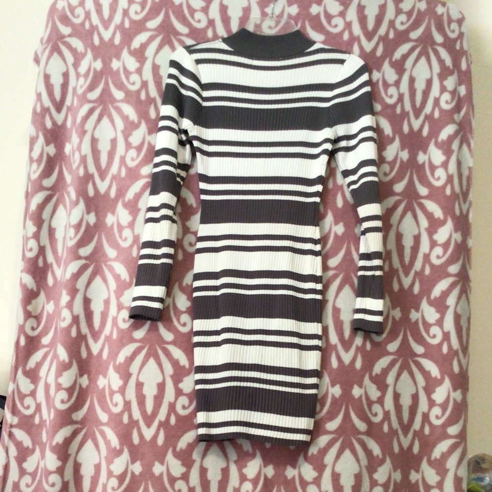 Long sleeve purple and off white striped knee length dress.